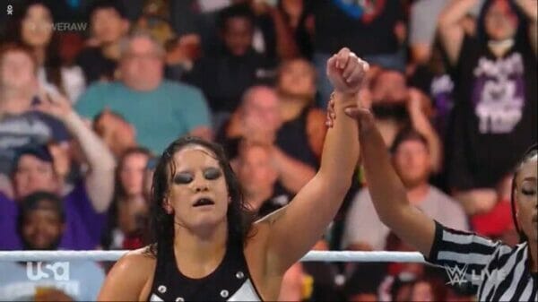 A fighter challenging her fist during Wwe Raw.
