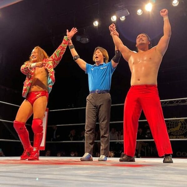 Superluchas - Tres luchadores compitiendo en la AJPW "Real World Tag League 2023" Día 4, parados en un ring de lucha libre.