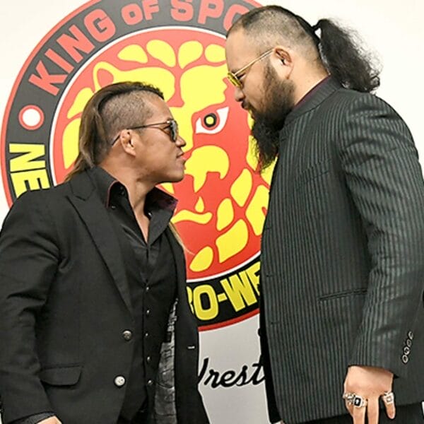 Superluchas - Dos hombres vestidos con trajes negros, uno que se parece a Ishimori de NJPW y el otro a O-Khan.