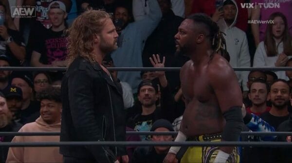 Superluchas - Dos luchadores, Samoa Joe y Swerve Strickland, uno al lado del otro en un ring durante el Campeonato AEW.