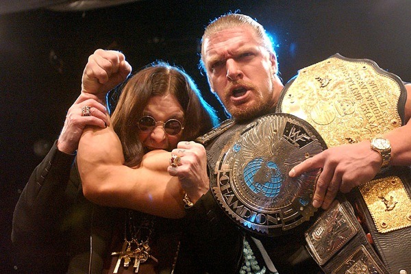 Ozzy Osbourne biting the arm of the then indisputable wwf champion, Triple H (March 21, 2022) - WWE