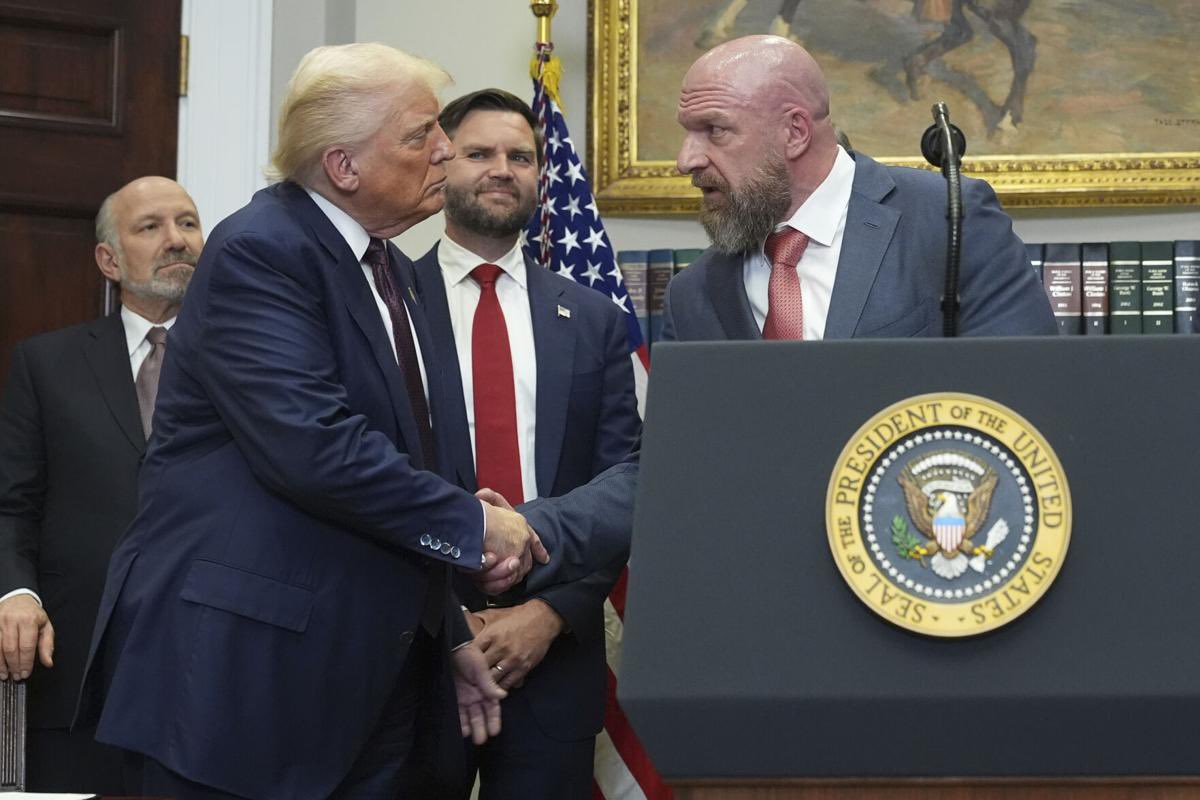 The president of the United States, Donald Trump, shakes hand with triple H in the White House (August 1, 2025)