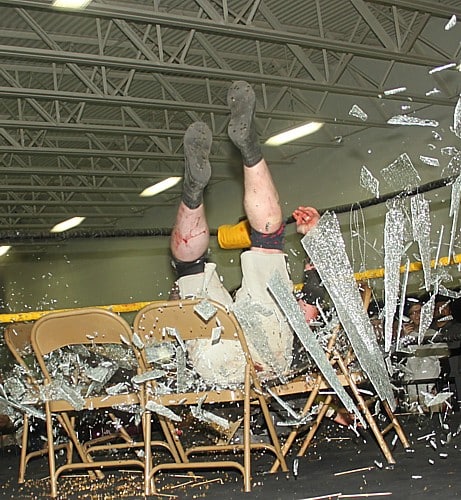 MASADA es tirado contra unas Sillas llenas de vidrio por Christina von Eerie en el Aniversario 14 de CZW / Photo by: Lyle Williams